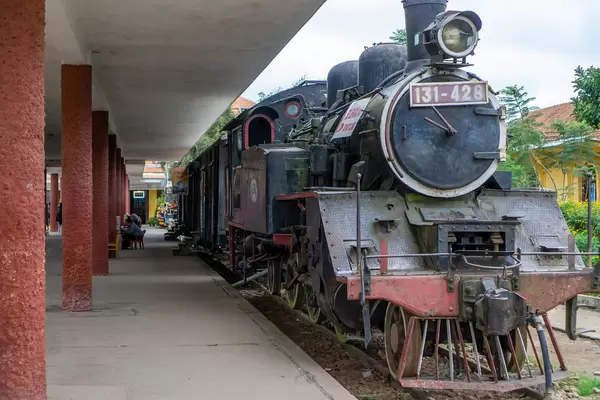 Old Steam Engine Locomotive with Waggons parking at the Dalat Railway Station as a Tourist Attraction in Da Lat, Vietnam