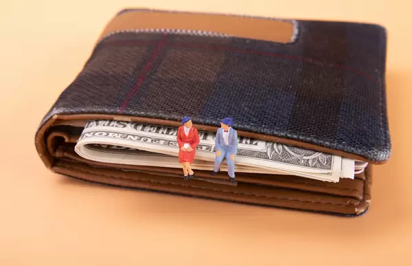 Older couple sitting on a wallet