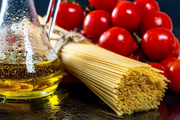 Olive oil, spaghetti and red chili pepper close-up