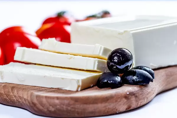 Olives with feta cheese on the kitchen Board  Flip 2019