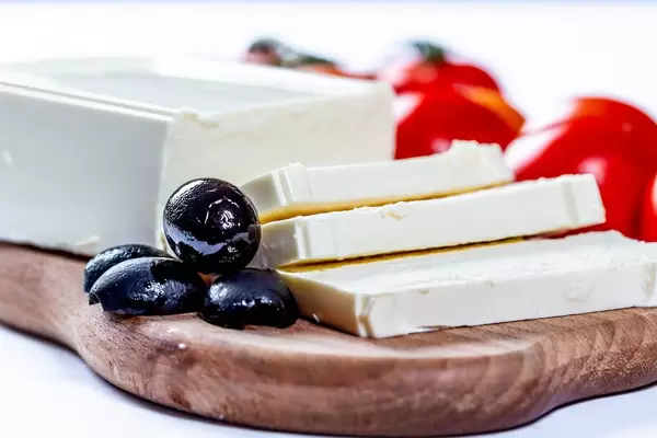 Olives with feta cheese on the kitchen Board