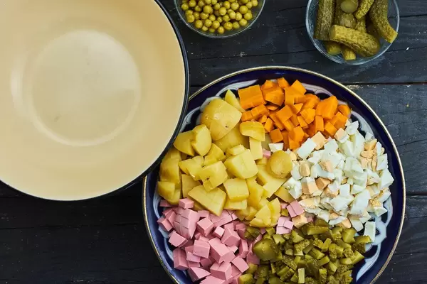 Olivier salad ingredients prepared on the plate