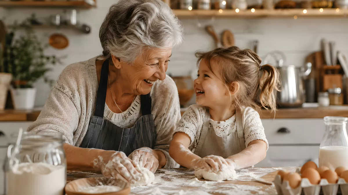 Oma und Enkelin backen gemeinsam Teig in Küche