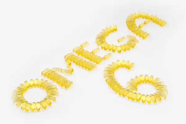 OMEGA 6 written with fish oil capsules containing fatty acids