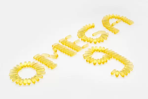 OMEGA 9 written with fish oil capsules containing fetty acids