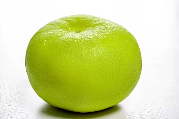 One whole Citrus Sweetie (Oroblanco ) on white background