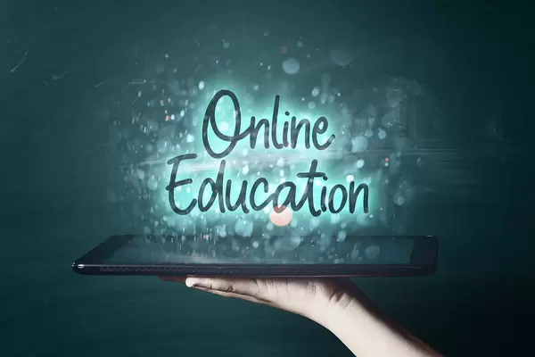 Online education concept - a person with tablet