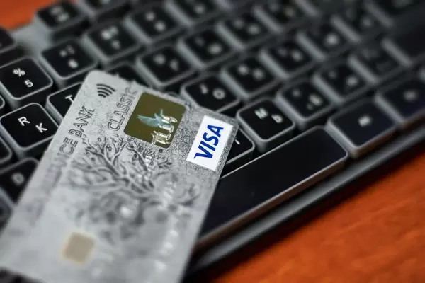 Online shopping. Visa credit card on keyboard