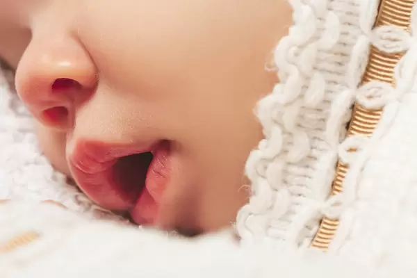 Open mouth of a small child while sleeping, close-up
