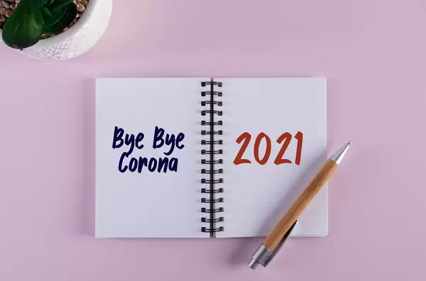 Open notebook with Bye Bye Corona 2021 text