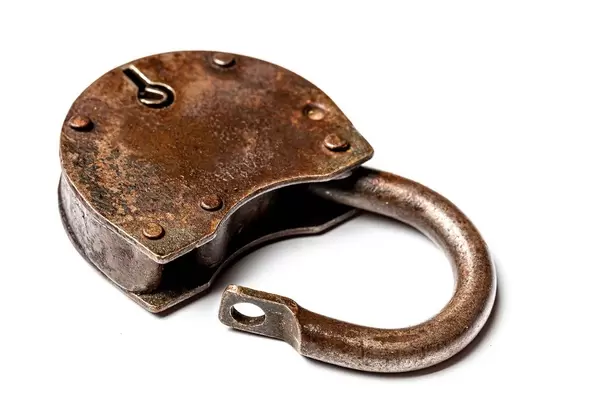 Open the old padlock on a white background (Flip 2020)