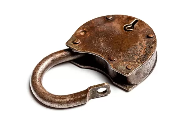 Open the old padlock on a white background
