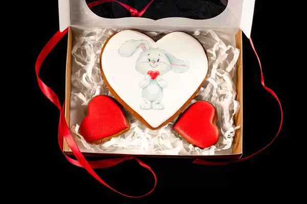Open valentine's day gift box with gingerbread hearts