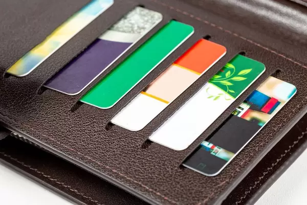 Open wallet with plastic cards, close -up
