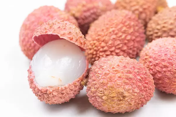 Opened Lychee fruit on the plate