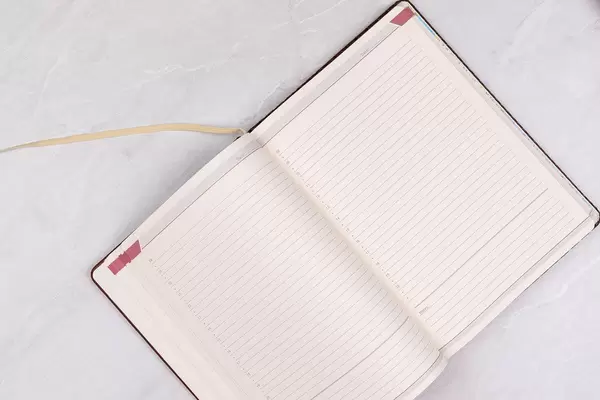 Opened Paper Notebook with Business concept and copy space