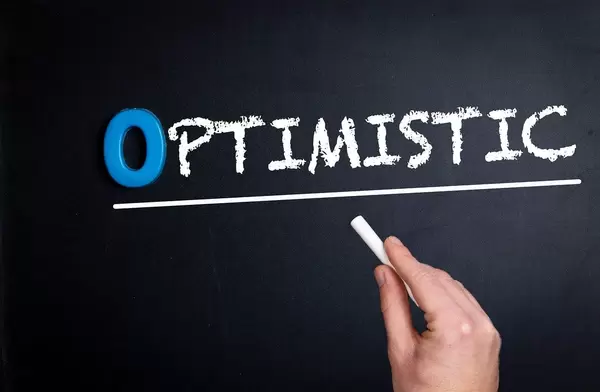 Optimistic text on blackboard