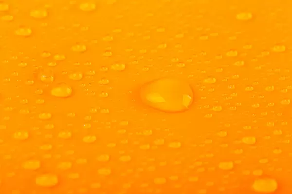 Orange background with water drops