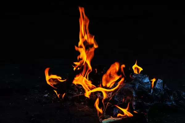 Orange fire flames on dark background