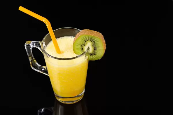 Orange juice with Kiwi in the glass on the black background (Flip 2019)