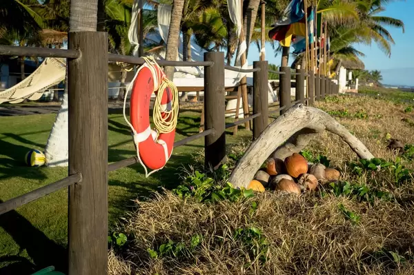 Orange lifesaver tied to wooden fence