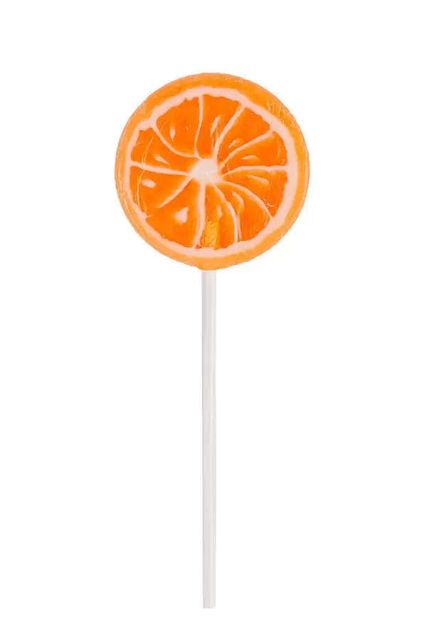 Orange lollipop on white background