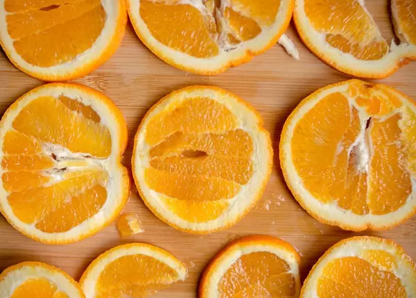 Orange Slices on Wood Board