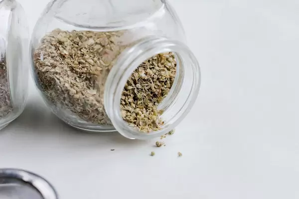 Oregano in a small glass jar