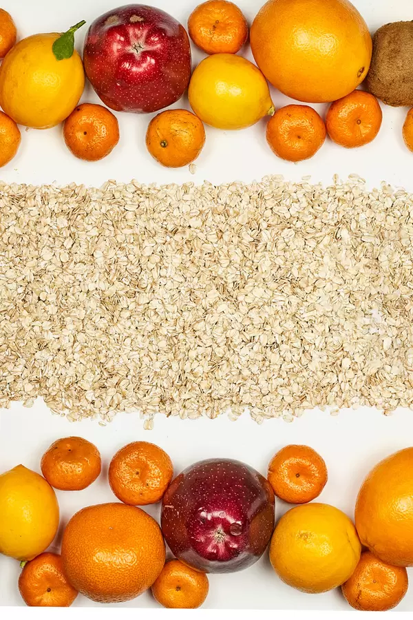 Organic and tropical raw fruits with oatmeal