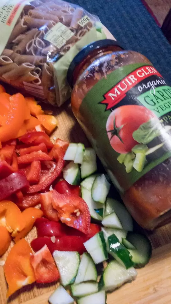 Organic penne pasta, Muir Glen organic sauce, cut orange and red peppers and cucumber