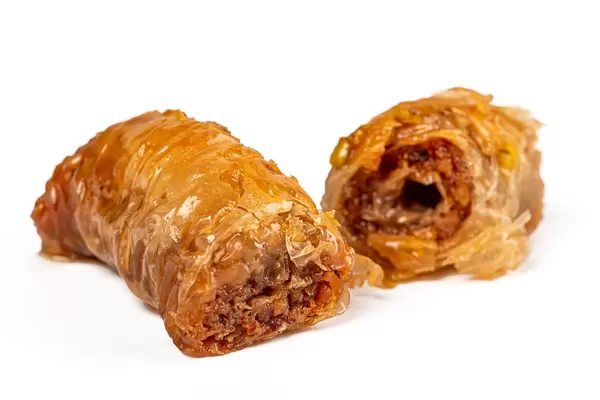 Oriental sweets, baklava with walnut and pistachio, close up