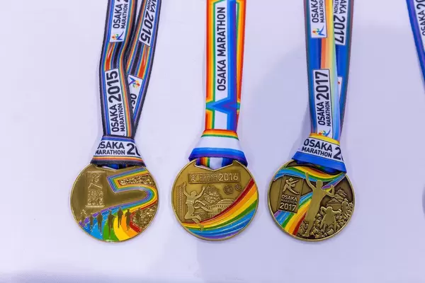 Osaka Marathon tradition to celebrate diversity with gay flag colors on runners medals