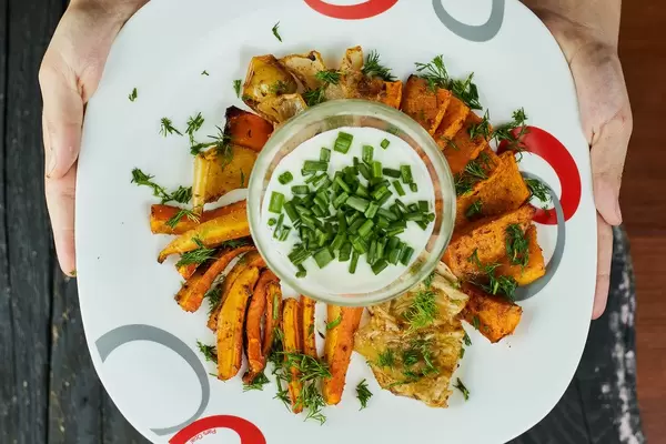Oven baked vegetable fries with carrots, potato and onions