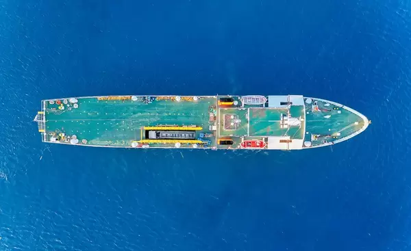 Overhead drone shot of the Greek cargo ship Kapetan Christos with its blue deck