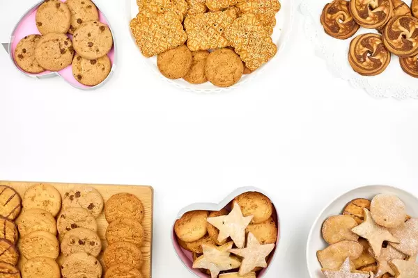 Overhead view of different cookies set on white