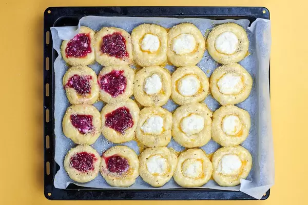 Overhead view of raspberry and cottage cheese buns