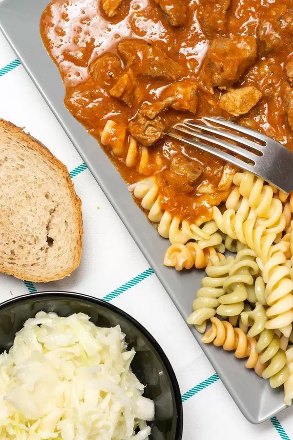 Overview above colorful Macaroni with meat Goulash