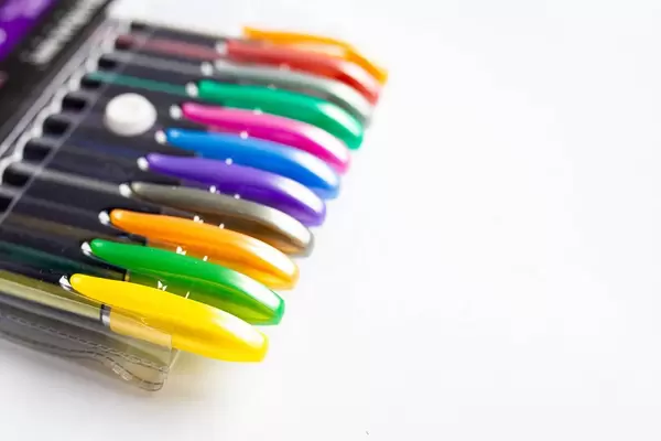 Pack of neon colored pens on white background