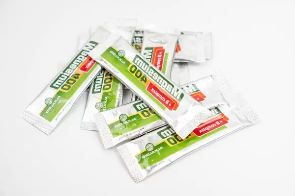 Packages of Magnesium powder on the white background (Flip 2020)