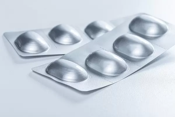 Packed antibiotics in blisters on a white background (Flip 2019)