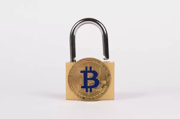 Padlock with golden Bitcoin on white background