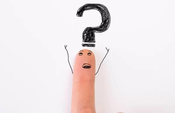 Painted happy finger with big question mark