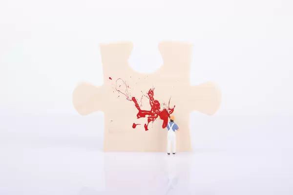 Painter painting a puzzle piece