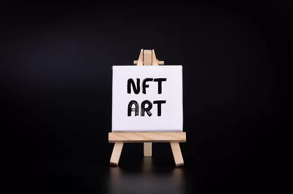 Painting art board with NFT Art text on black background