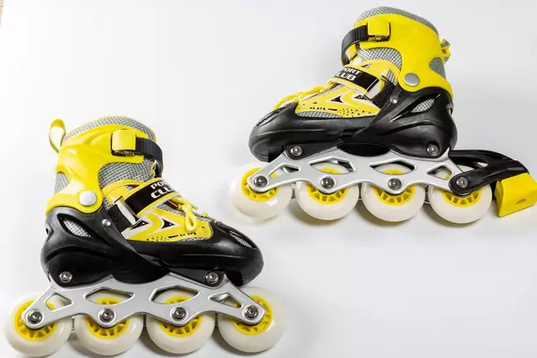 Pair of roller skates on white