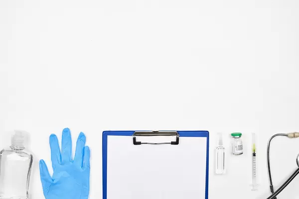 Pandemic times: medical and pharmaceutical equipment on white background with copy space