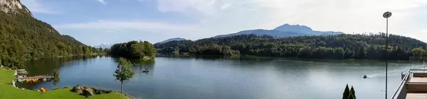 Panoramic shot of natural swimming lake Reintalersee in the Alpbach valley in Tyrol, Austria