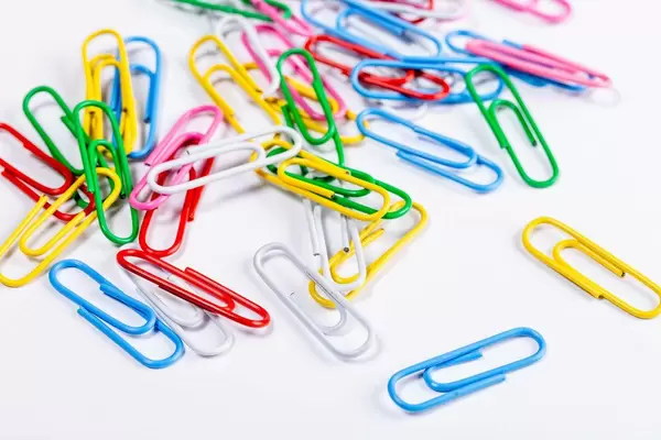 Paper clips on white background (Flip 2019)