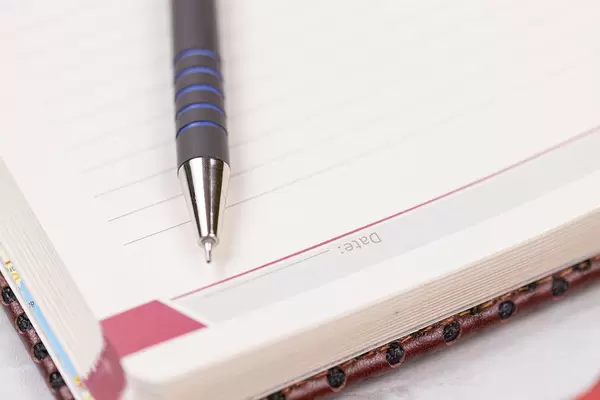 Paper Notebook and Pencil with Business concept