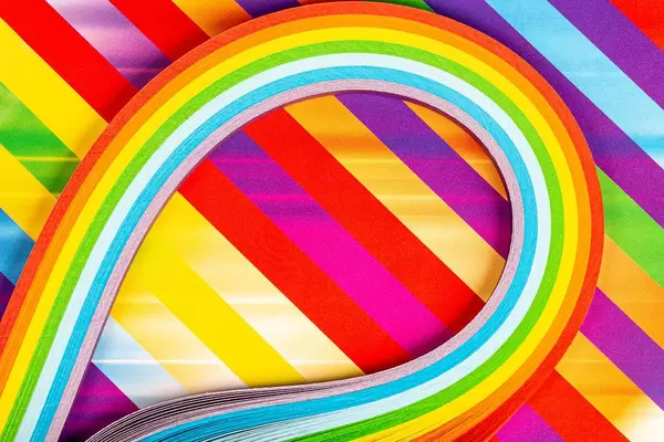 Paper strips in rainbow colors as a colorful backdrop